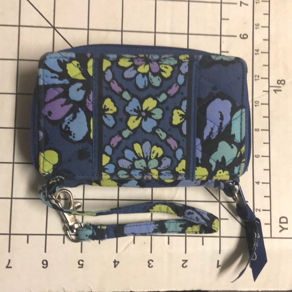 Vera Bradley Cell Phone Wallet Interior 5 small pockets, ID, 1 zip, large cash
